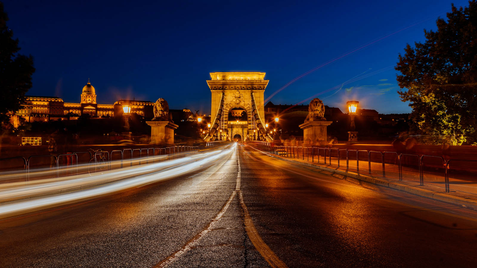The Chain Bridge in Budapest at blue hour with traffic going by as an example of what is time lapse photography?