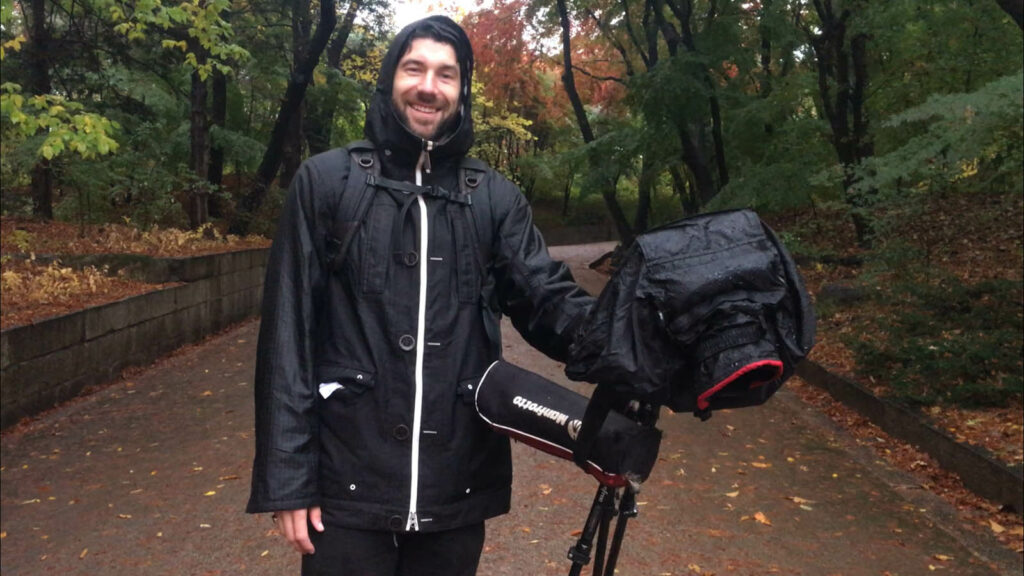 Scott in complete rain gear with camera as a reference image for Hyperlapse VS Timelapse